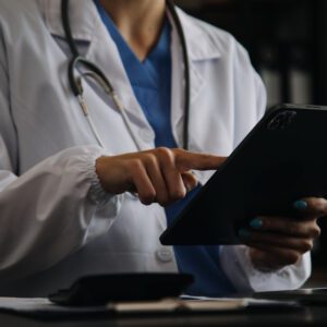 Female doctor using tablet