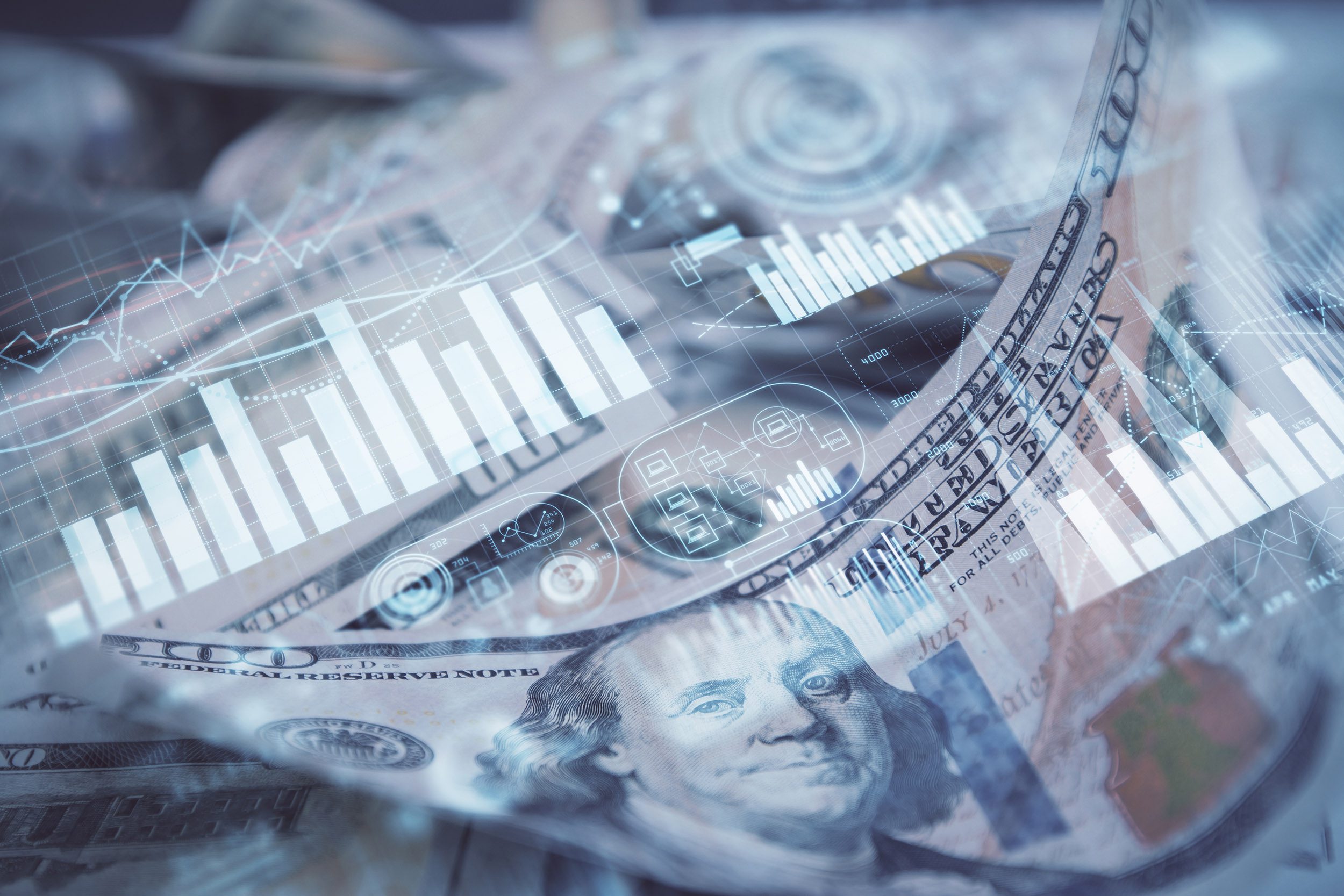 multiple Charts over U.S. dollar bills
