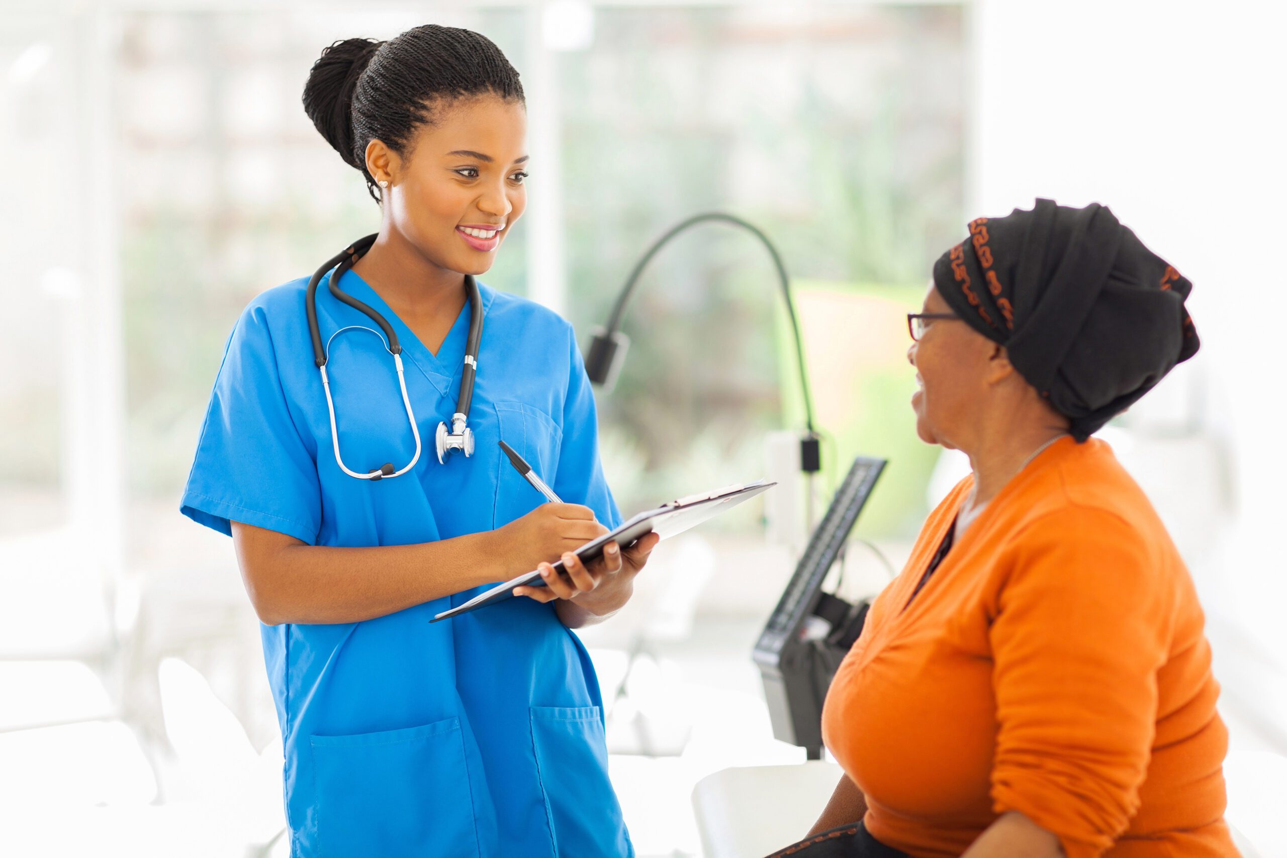African American nurse with patient