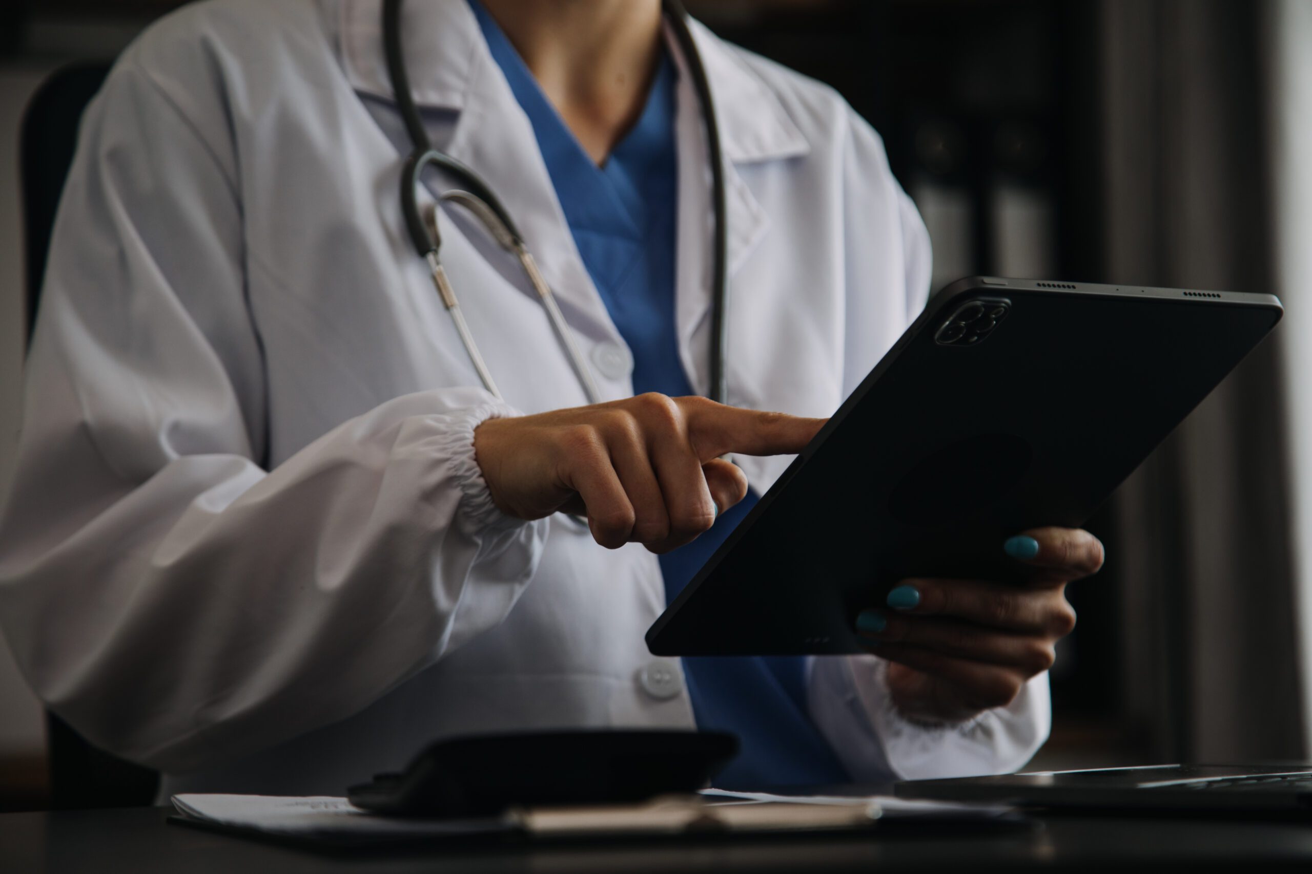 Female doctor using tablet