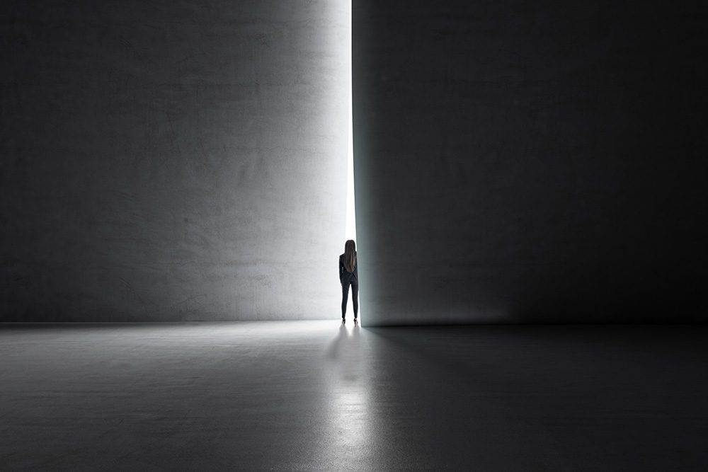 Person looking through a doorway into the future